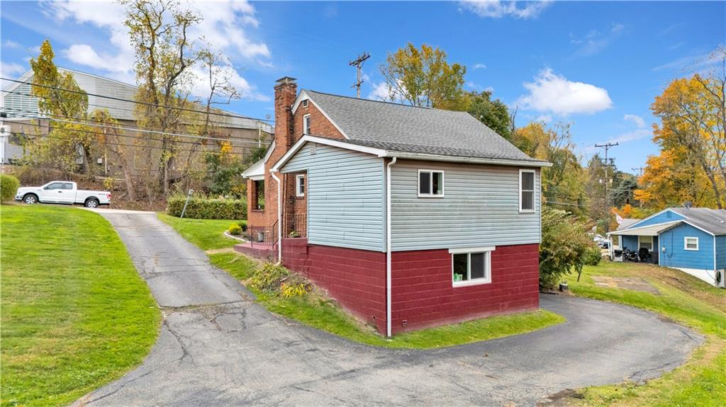 1002 Gringo Road Aliquippa, PA 15001 - Photo 3 of 6 a view of a house with a yard
