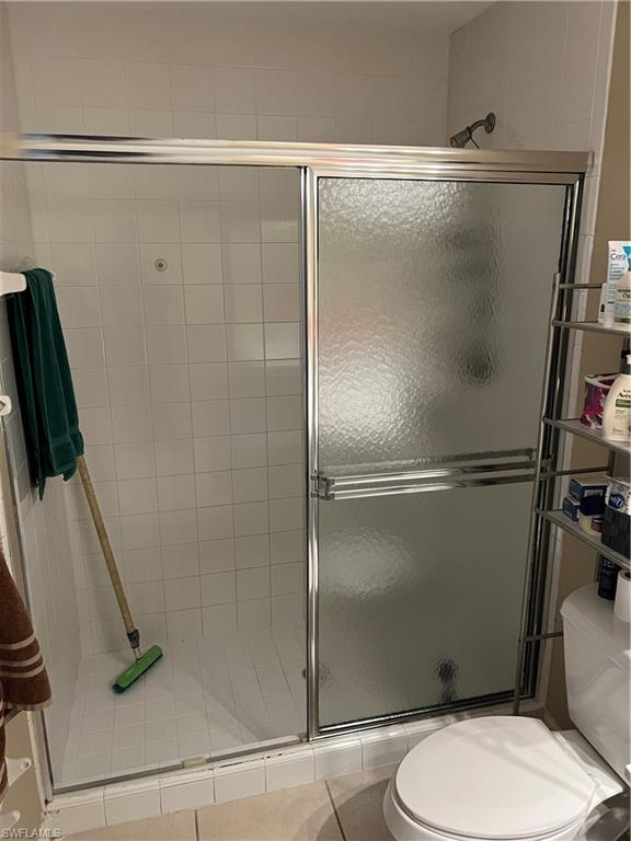 4618 19th Court Southwest Naples, FL 34116 - Photo 13 of 16 a bathroom with a shower and a toilet