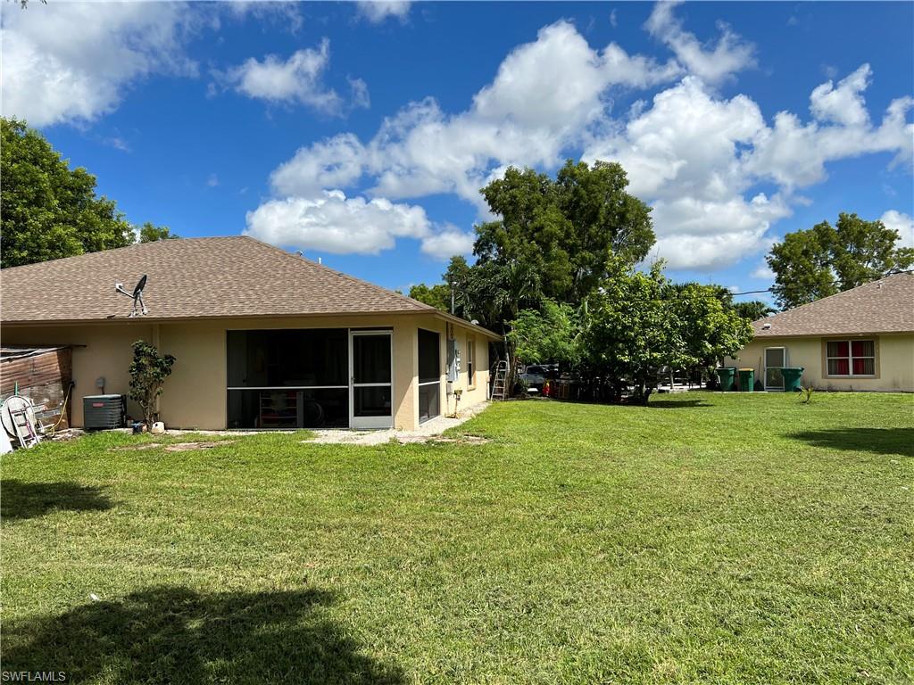 4618 19th Court Southwest Naples, FL 34116 - Photo 16 of 16 a view of a house with garden and yard