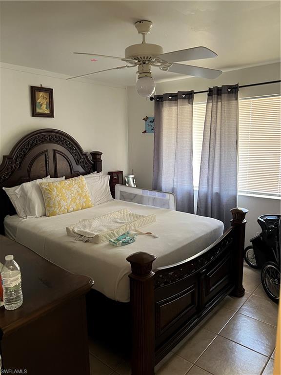 4618 19th Court Southwest Naples, FL 34116 - Photo 5 of 16 a bedroom with a bed and window