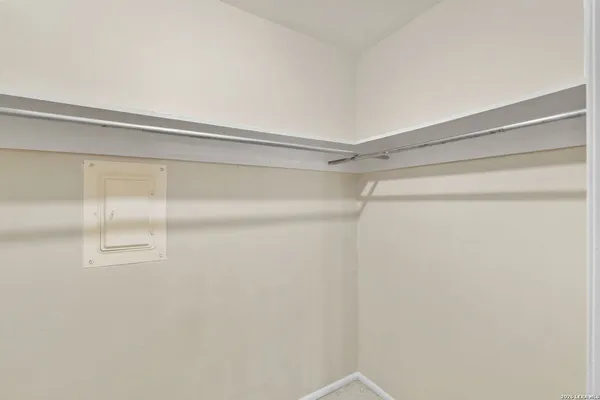 a view of a room with racks on the wall