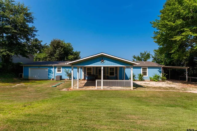 a front view of house with outdoor seating