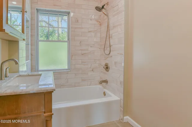 a bathroom with a sink and a bathtub