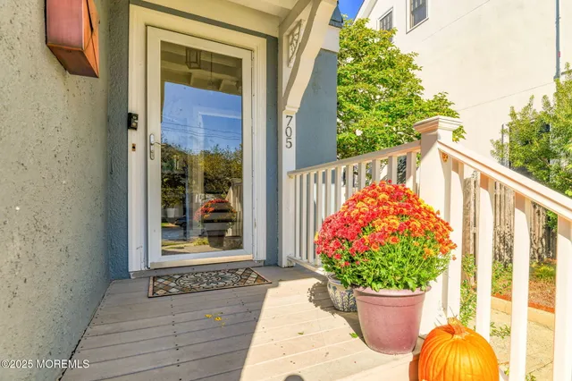 a view of a two chairs in the balcony