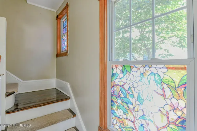 a bathroom with a vanity and a window