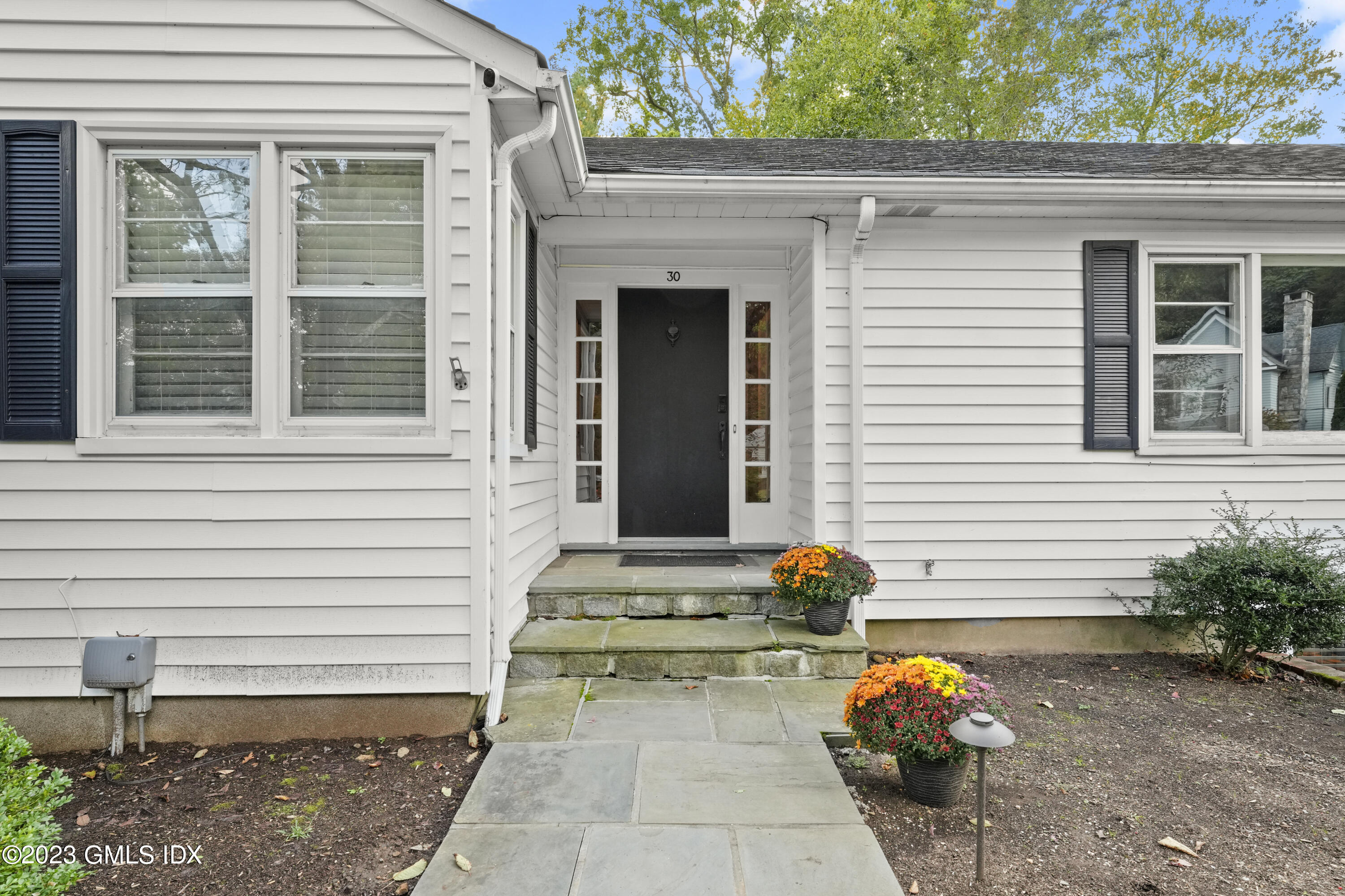 30 Skylark Road Greenwich, CT 06830 - Photo 2 of 28 a front view of a house with a yard