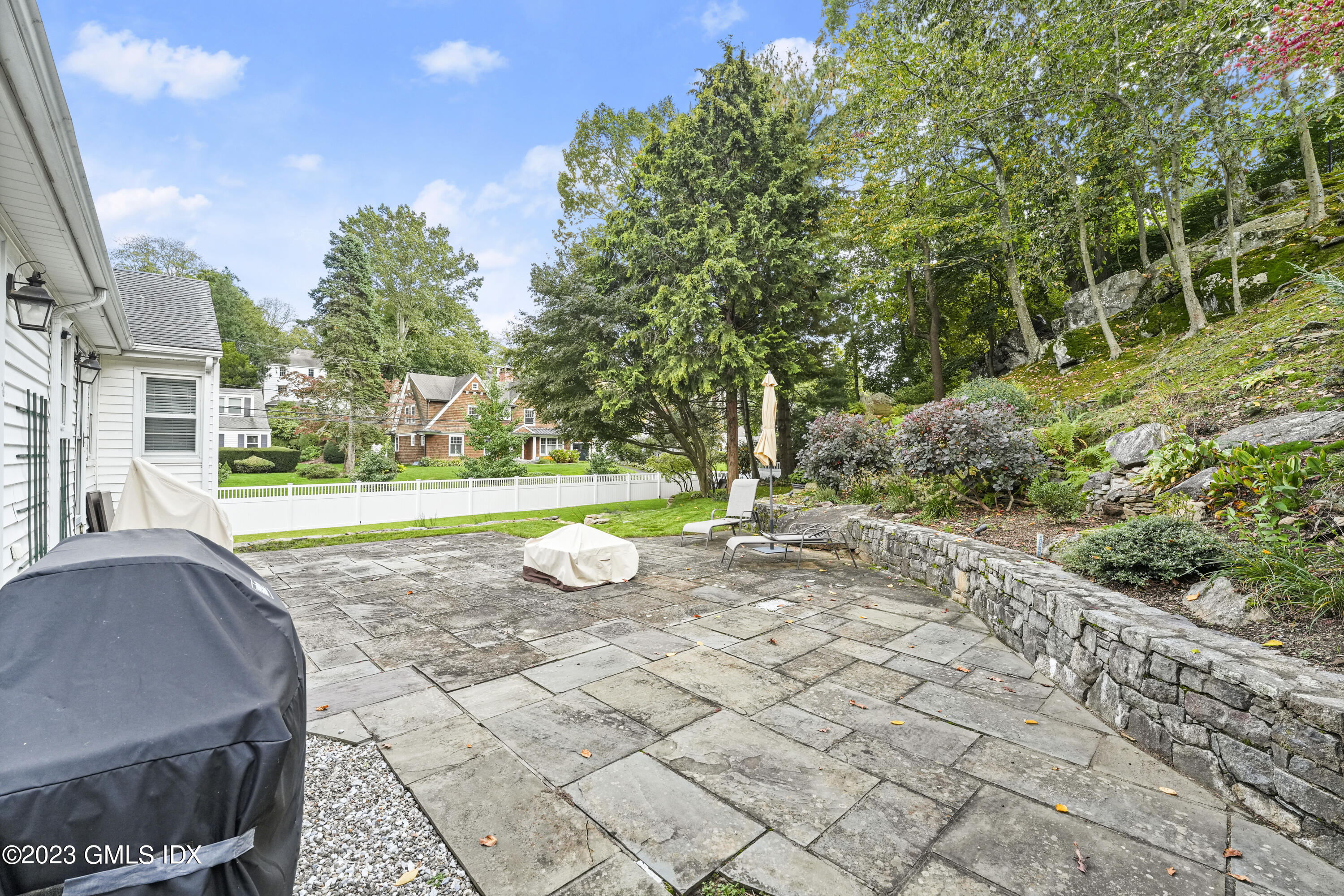 30 Skylark Road Greenwich, CT 06830 - Photo 8 of 28 a view of a house with a yard and potted plants