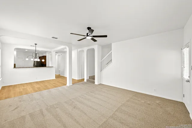 a view of a livingroom with a ceiling fan