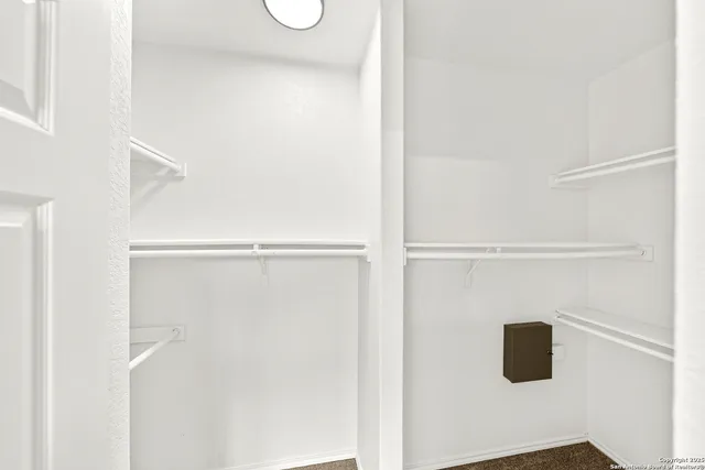 a view of a room with a white cabinet