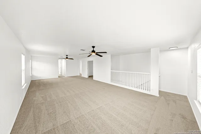 a view of a big room with closet and windows