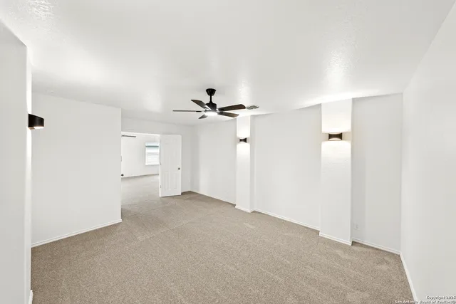 a view of a big room with carpet