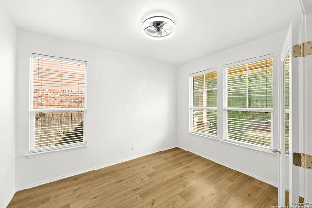 a view of a room with a large window