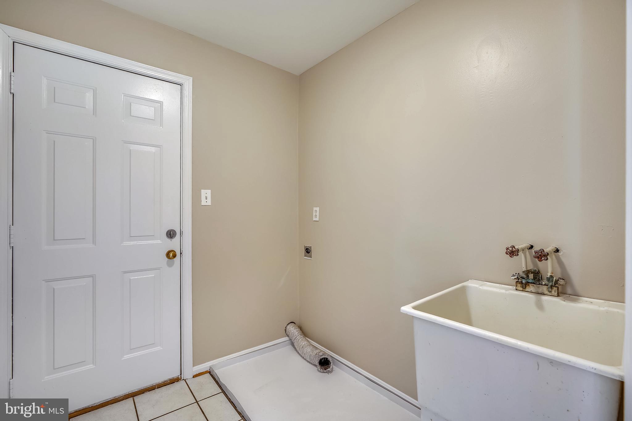 9354 Mellenbrook Road Columbia, MD 21045 - Photo 19 of 36 Main level laundry/mud room leading to garage