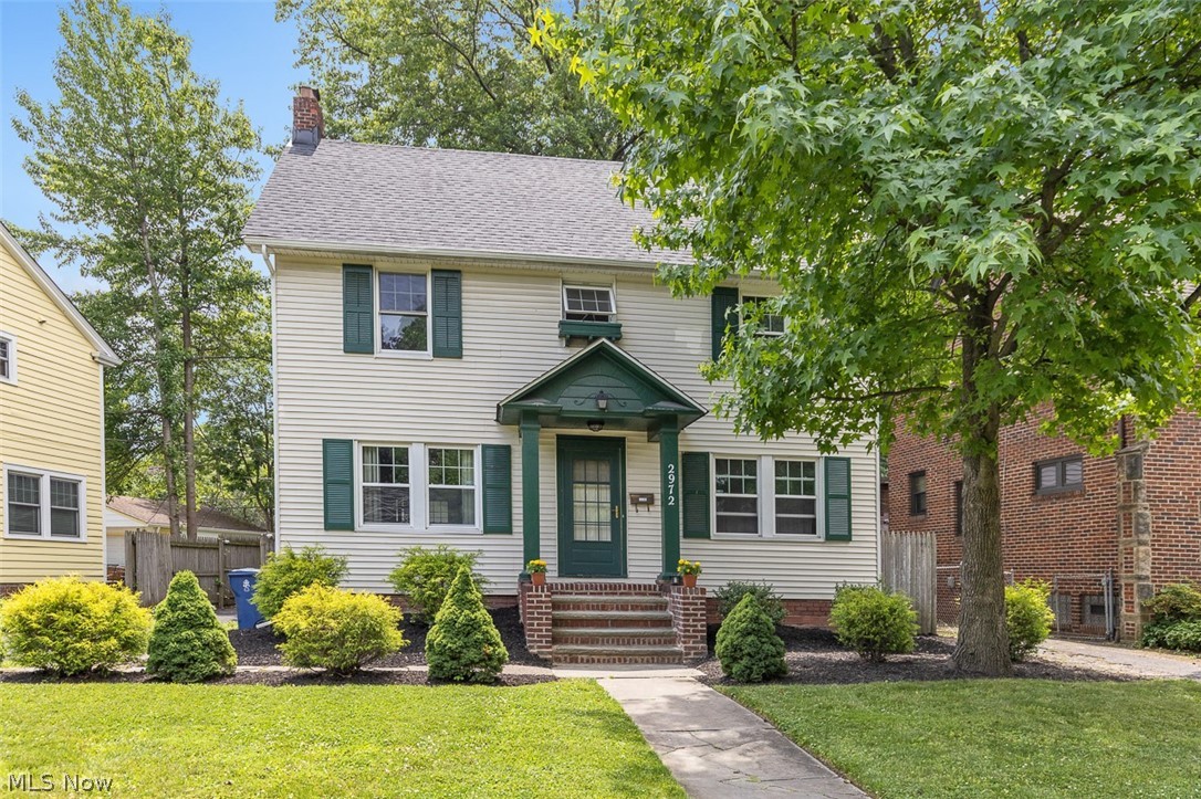 2972 Yorkshire Road Cleveland Heights, OH 44118 - Photo 1 of 44 Classic two-story residence with light-colored siding and dark green shutters