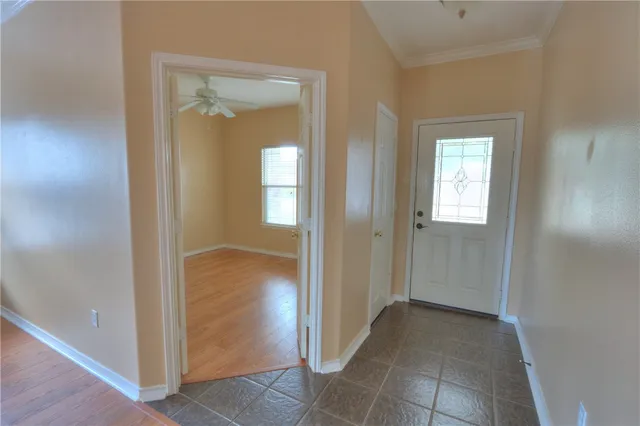 an empty room and closet with wooden floor