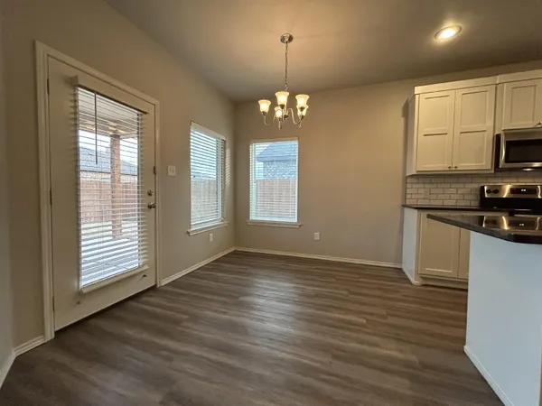 a view of kitchen and windows
