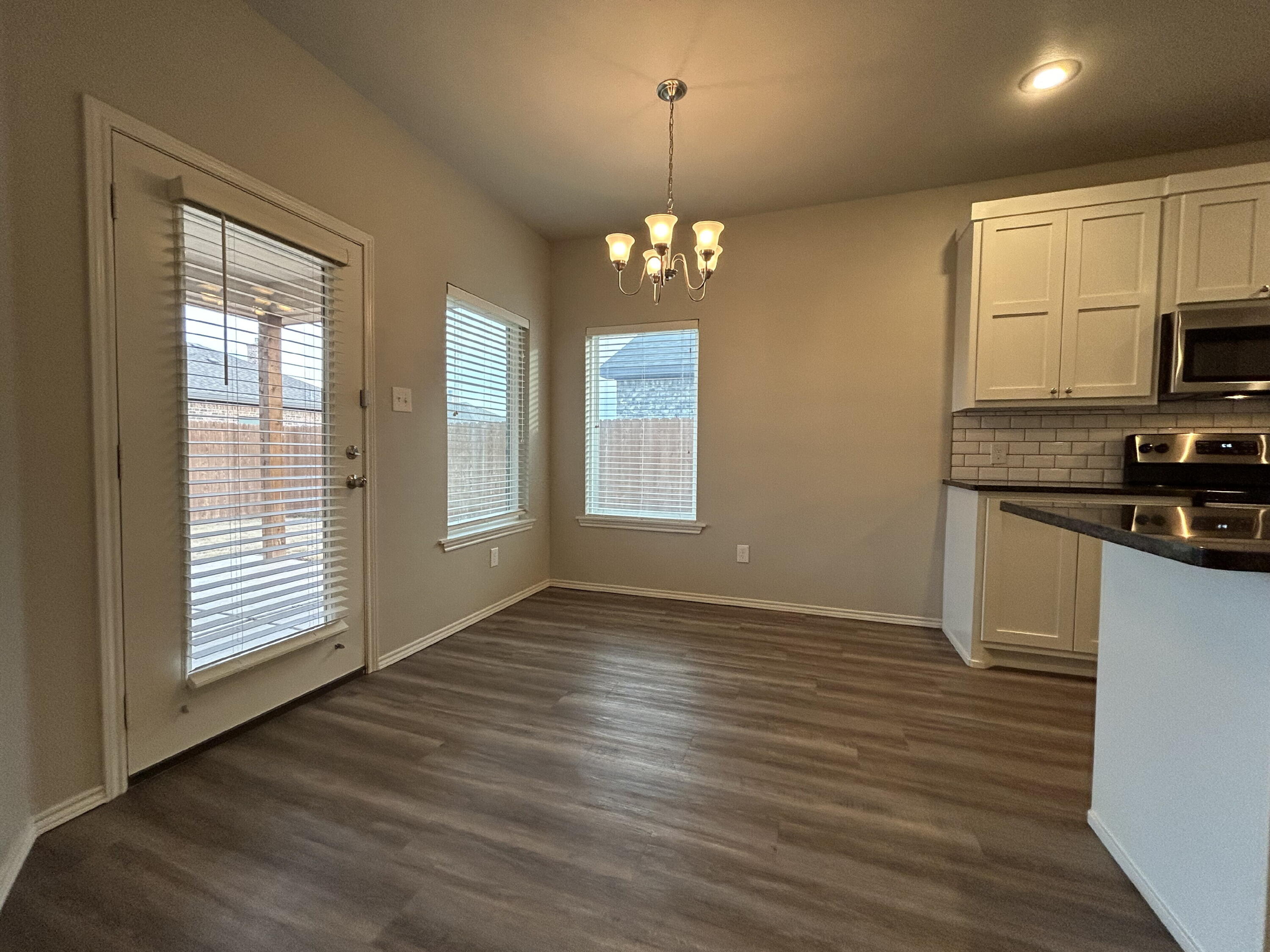 5843 Itasca Street Lubbock, TX 79416 - Photo 4 of 10 a view of kitchen and windows