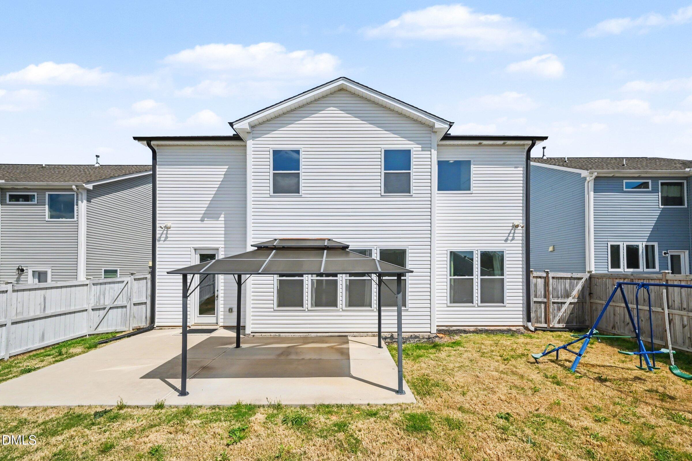 7015 Grainfield Road Mebane, NC 27302 - Photo 37 of 42 a view of a house with backyard and roof