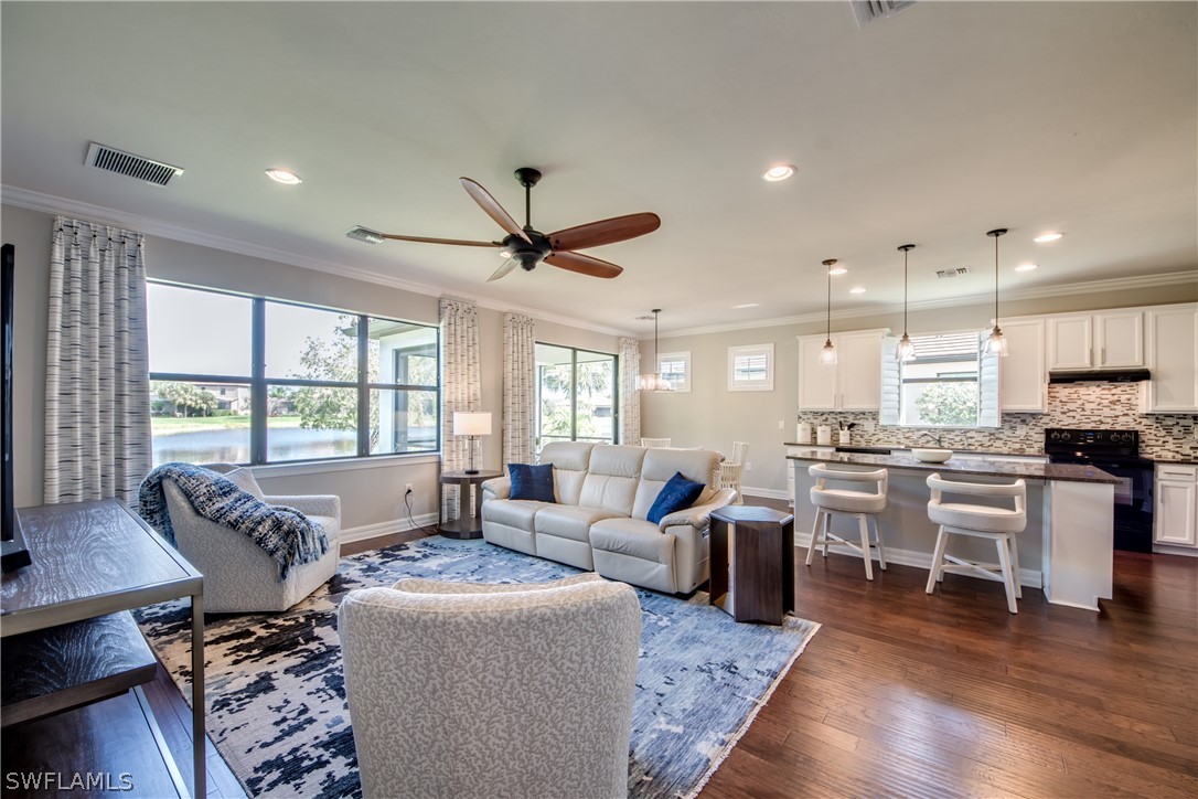 10898 Dennington Road Fort Myers, FL 33913 - Photo 4 of 35 a living room with furniture kitchen view and a large window