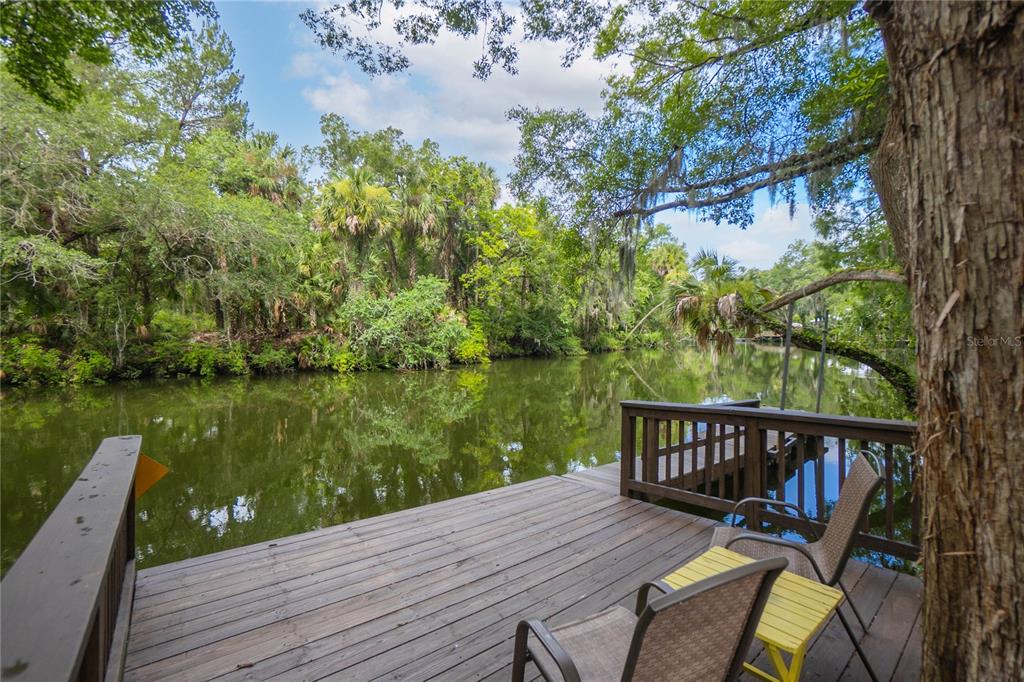 a wooden bench sitting next to a lake