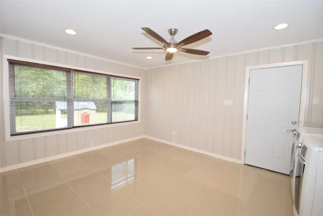 a view of a hallway with washer and dryer
