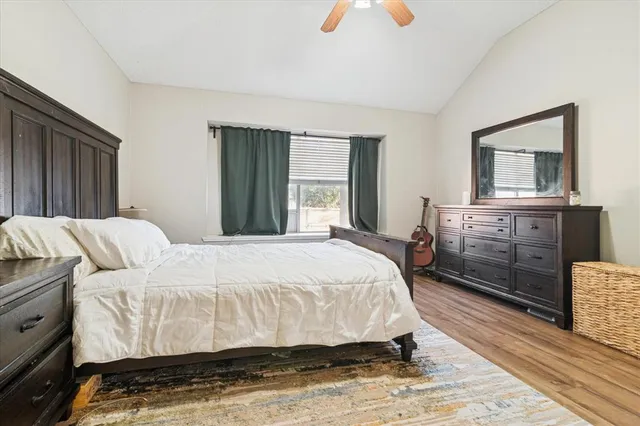 a bedroom with a bed and a dresser