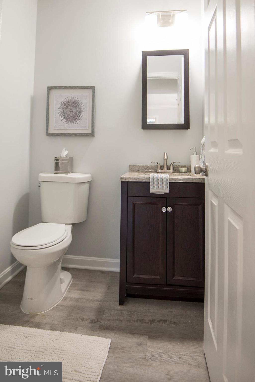 5627 Gunner Run Road Churchton, MD 20733 - Photo 33 of 81 1/2 bath new vanity, toilet, flooring, light