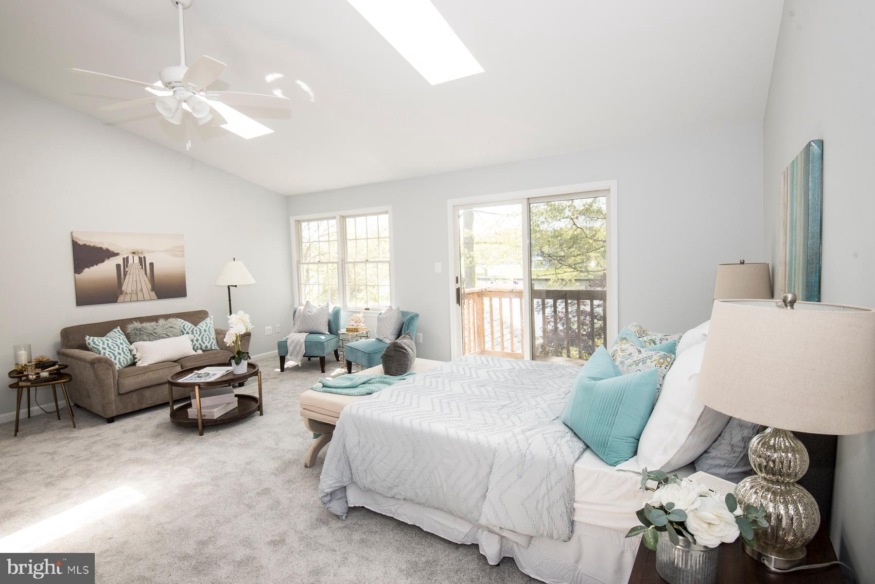 5627 Gunner Run Road Churchton, MD 20733 - Photo 40 of 81 Primary bedroom vaulted ceiling, skylights, deck