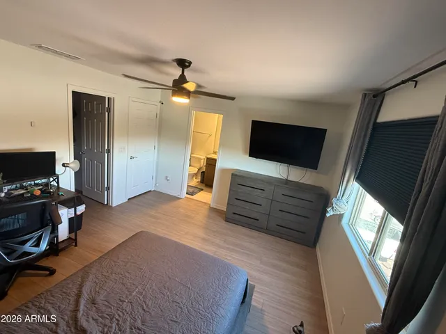 a view of a livingroom with furniture and a flat screen tv