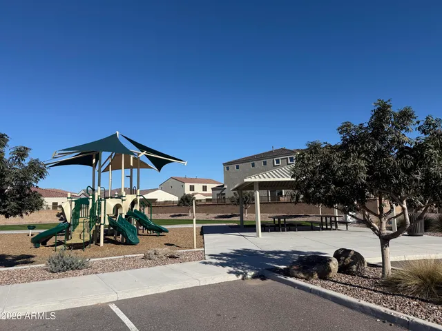 a front view of a house with a street