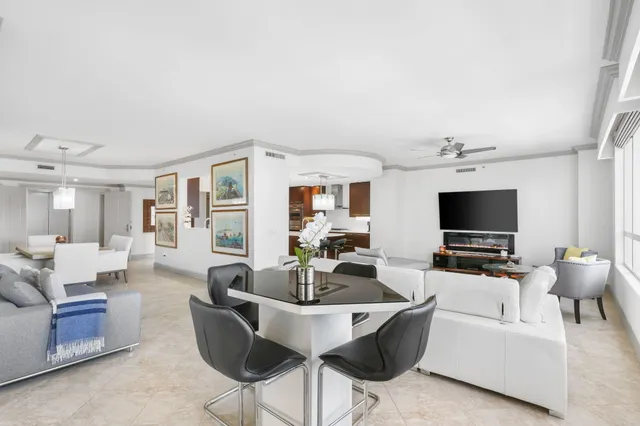 a bathroom with a granite countertop double vanity sink and mirror