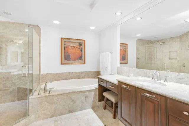 a bedroom with a bed and flat screen tv