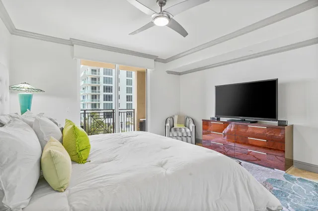 a view of a balcony with furniture and city view