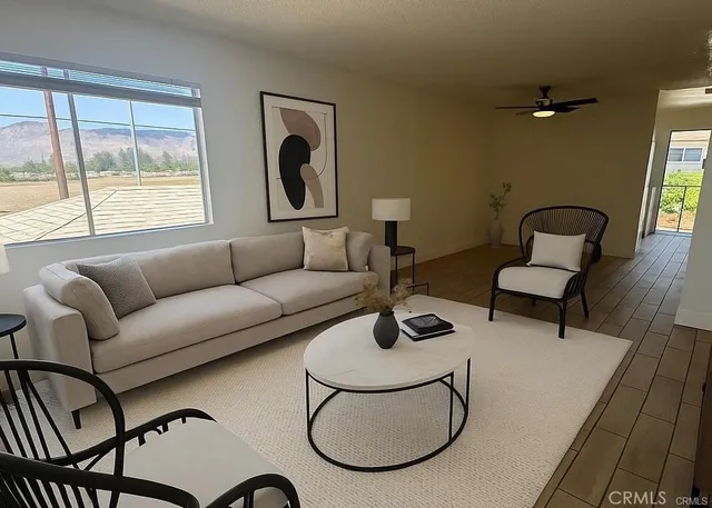 a living room with furniture and a large window