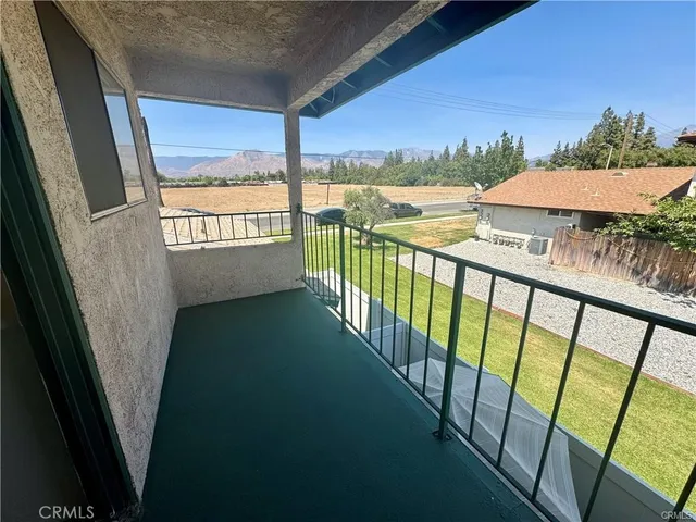 a view of balcony with furniture