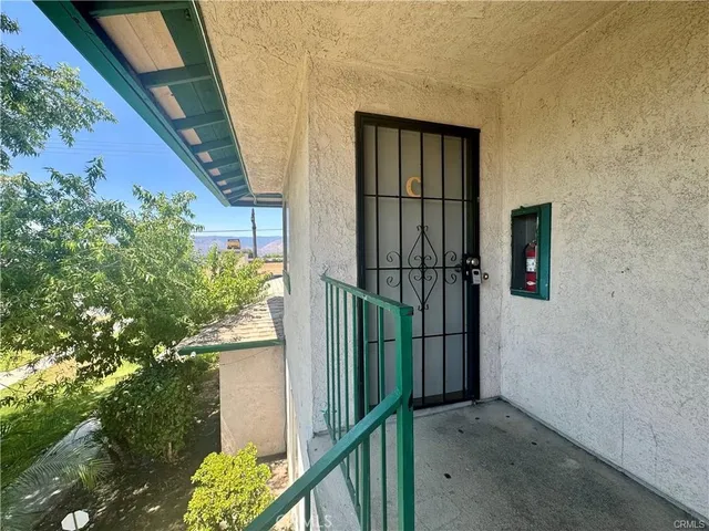 front view of a house with a small yard