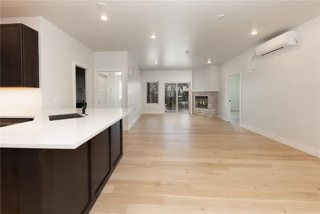a large bathroom with a sink a mirror and shower