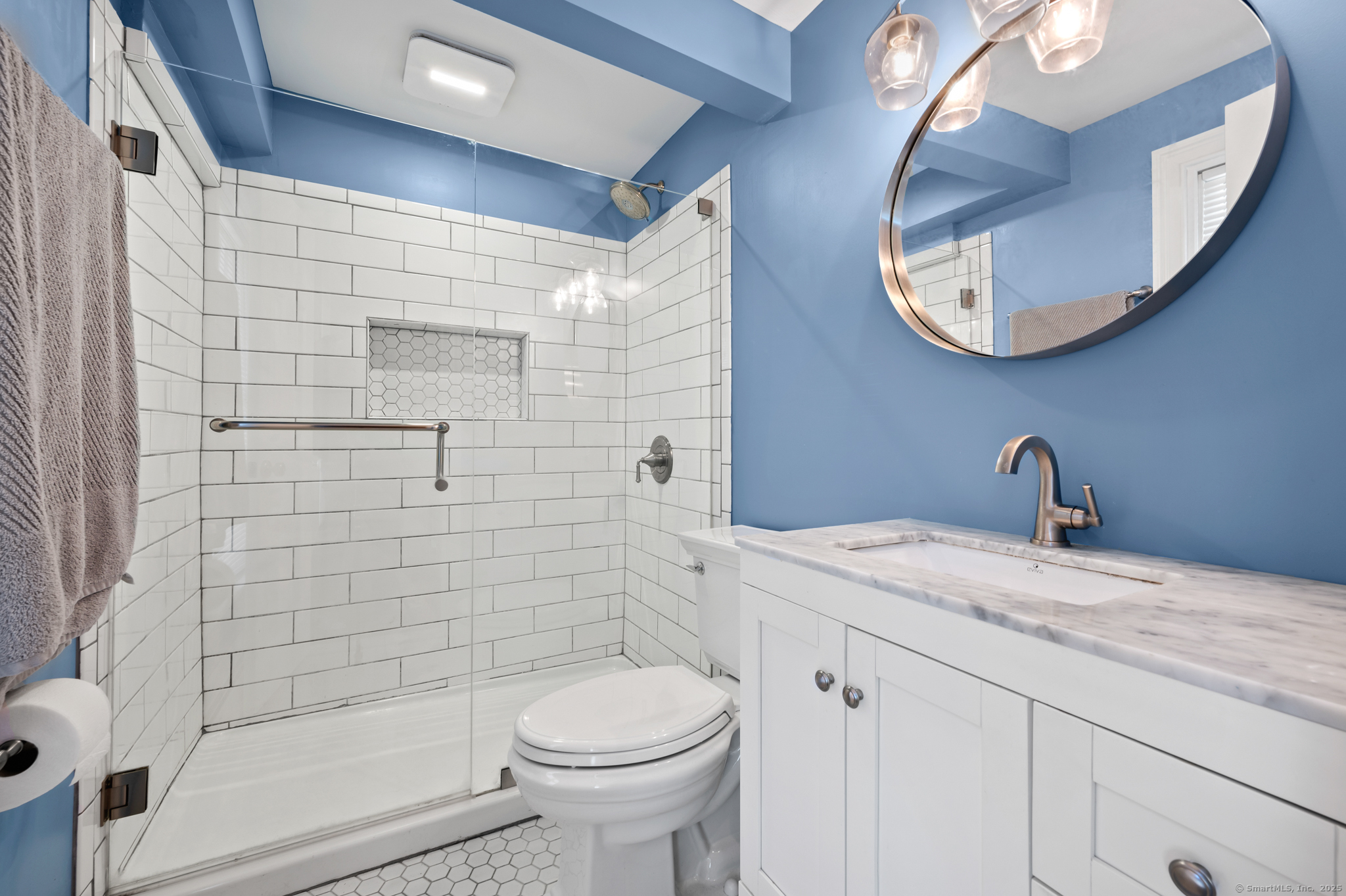 6 Howe Street Milford, CT 06460 - Photo 13 of 32 a bathroom with a sink a toilet and shower