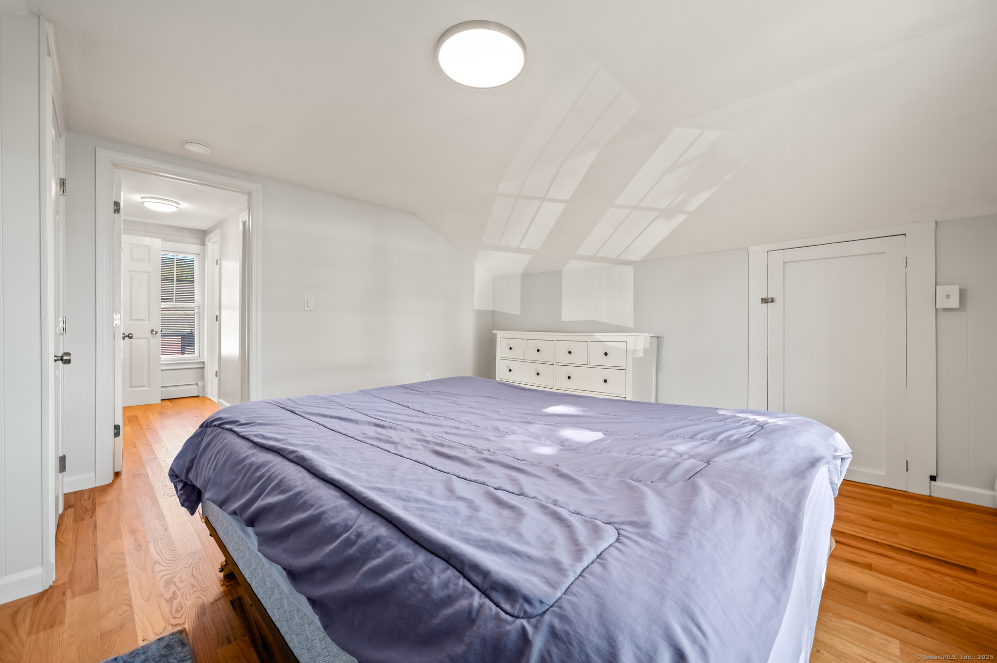 6 Howe Street Milford, CT 06460 - Photo 21 of 32 a bedroom with a bed and a table