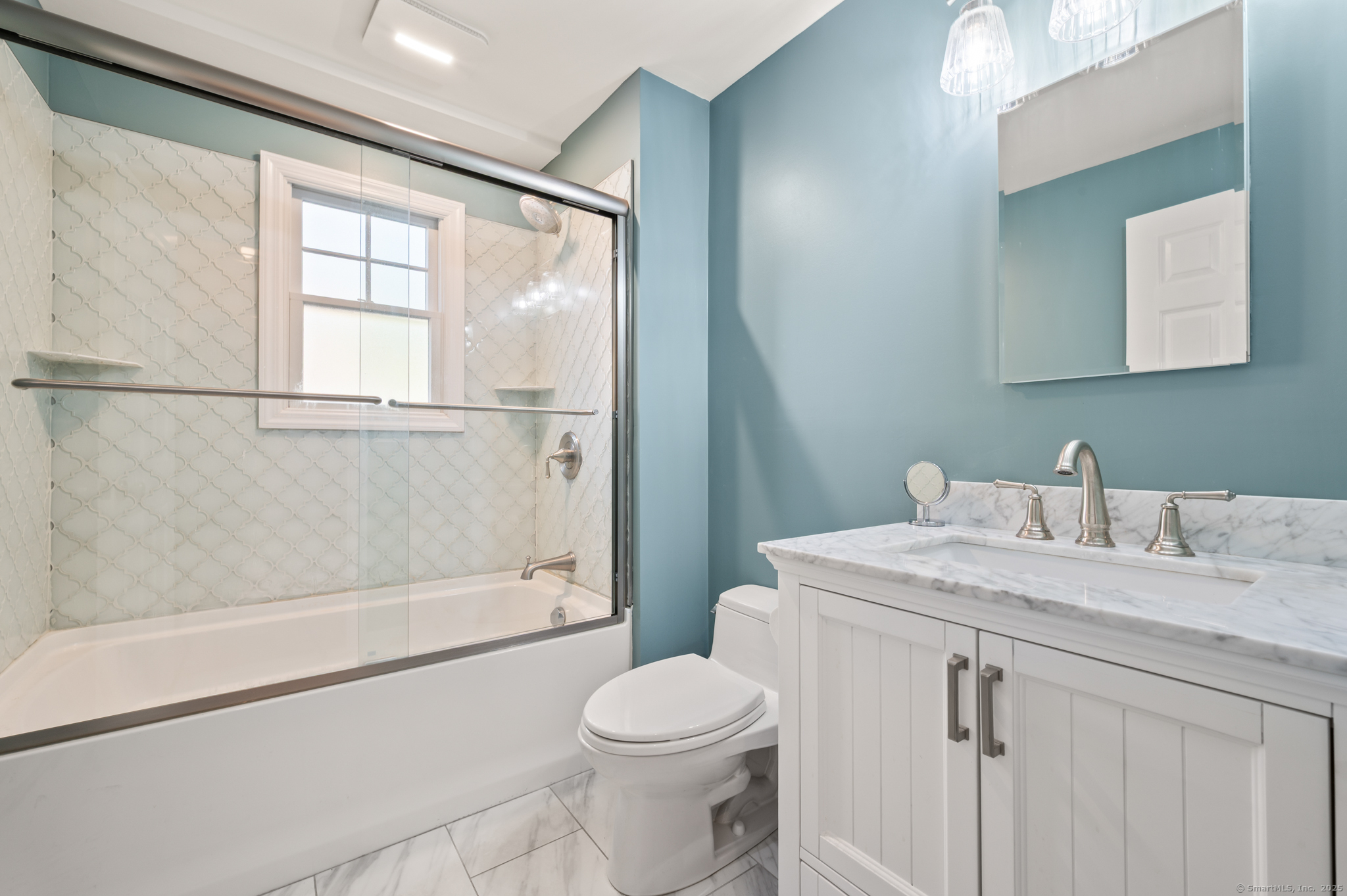 6 Howe Street Milford, CT 06460 - Photo 22 of 32 a bathroom with a granite countertop sink toilet and shower