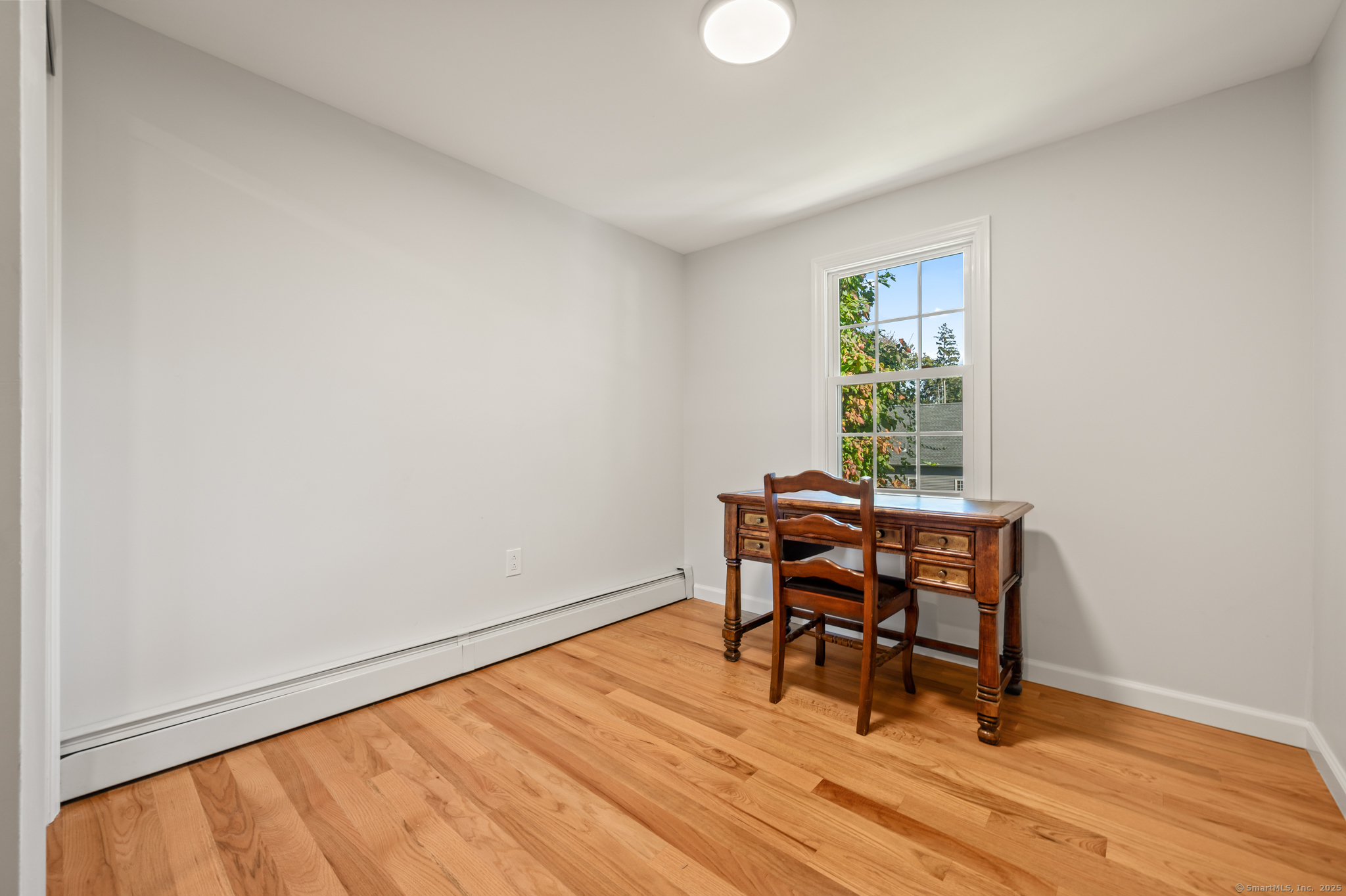 6 Howe Street Milford, CT 06460 - Photo 25 of 32 a workspace room with furniture and wooden floor