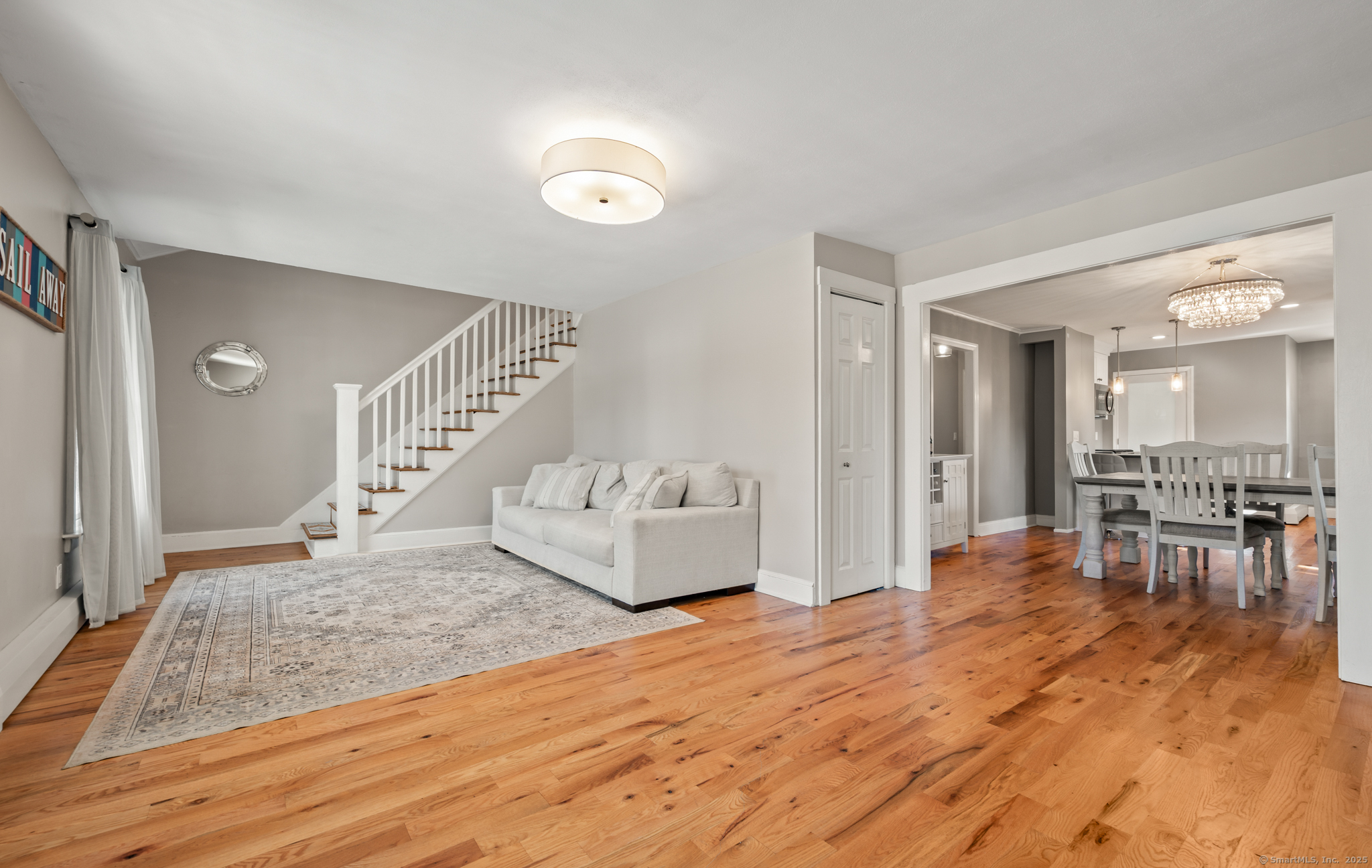 6 Howe Street Milford, CT 06460 - Photo 10 of 32 a living room with furniture and a wooden floor