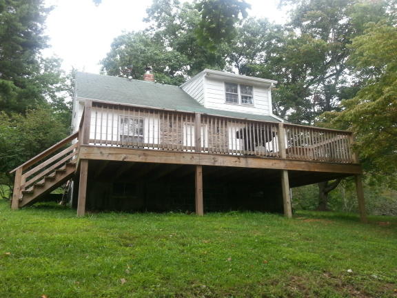 2753 Camp Carysbrook Road Riner, VA 24149 - Photo 1 of 19 a front view of house with yard and green space