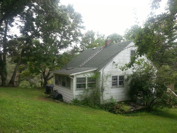 2753 Camp Carysbrook Road Riner, VA 24149 - Photo 15 of 19 a front view of a house with a garden