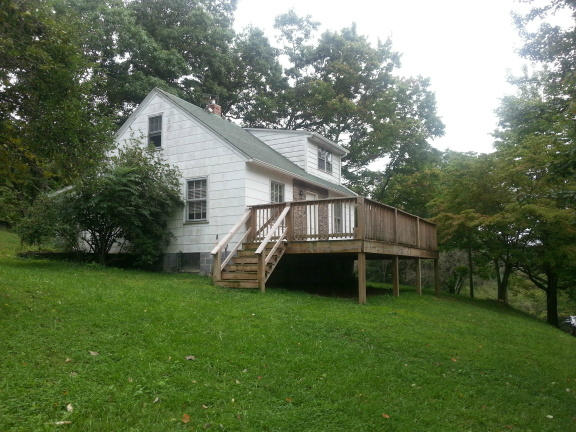 2753 Camp Carysbrook Road Riner, VA 24149 - Photo 17 of 19 a view of a house with a yard and sitting area