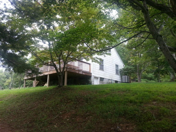 2753 Camp Carysbrook Road Riner, VA 24149 - Photo 18 of 19 a view of a house with a yard