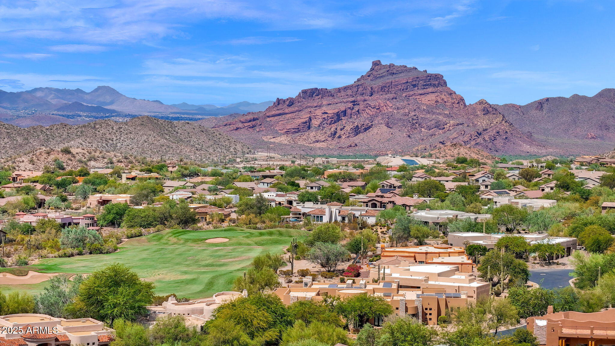 a view of a city with mountains in the background