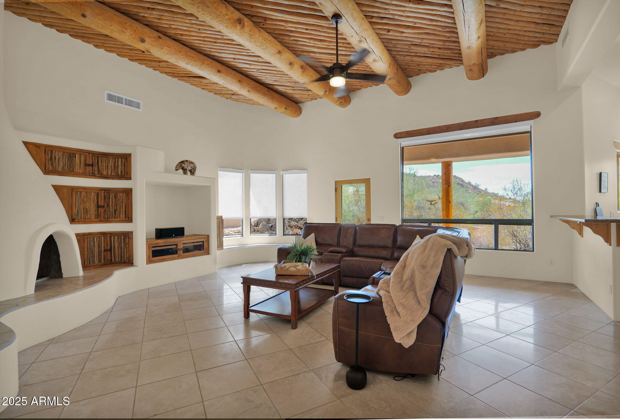 7130 East Saddleback Street, Unit 5 Mesa, AZ 85207 - Photo 13 of 57 a living room with furniture and a fireplace