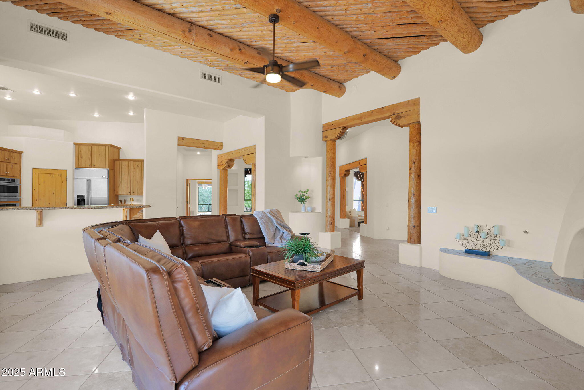 7130 East Saddleback Street, Unit 5 Mesa, AZ 85207 - Photo 15 of 57 a living room with furniture and a chandelier