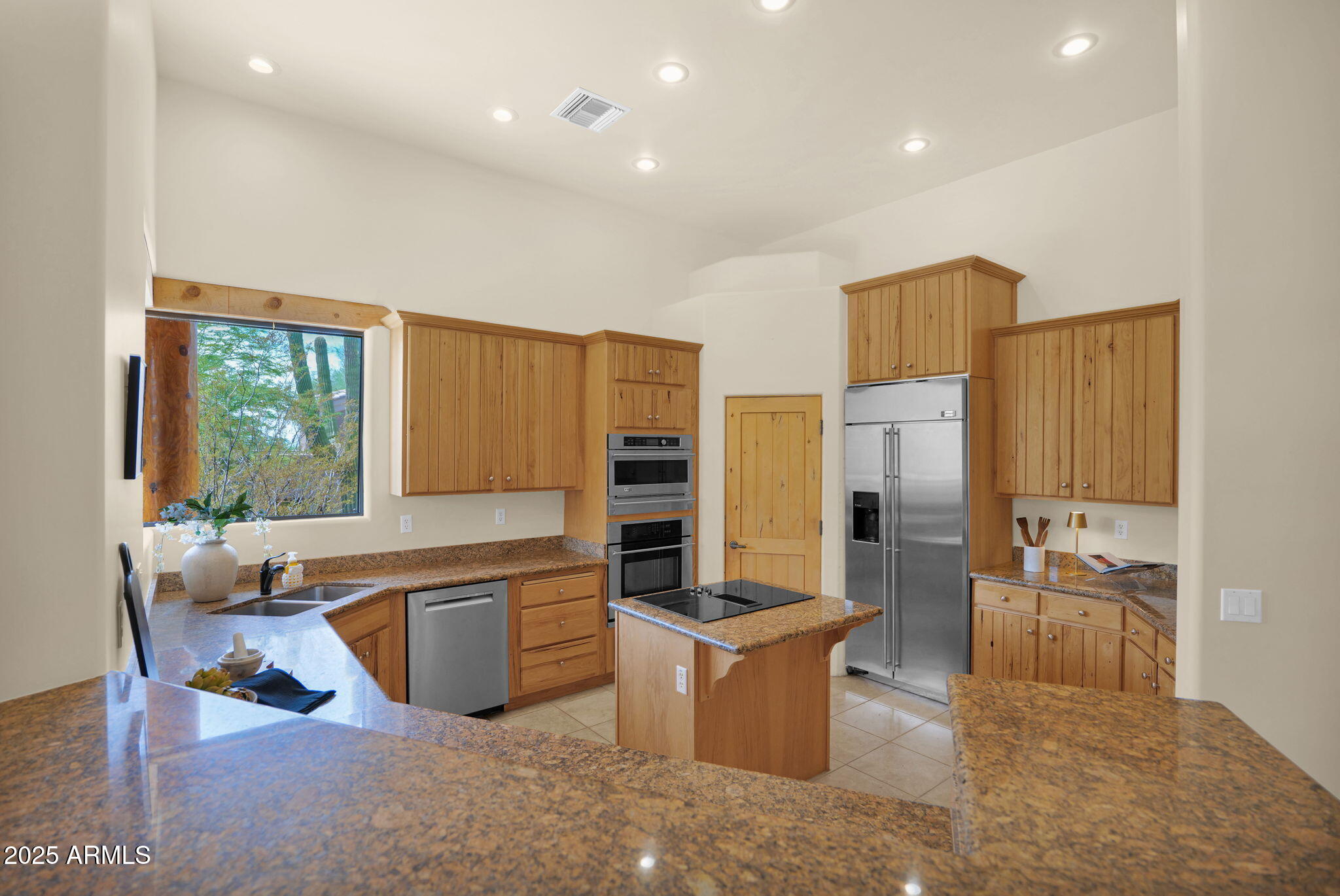 7130 East Saddleback Street, Unit 5 Mesa, AZ 85207 - Photo 19 of 57 a large kitchen with kitchen island a large window in it
